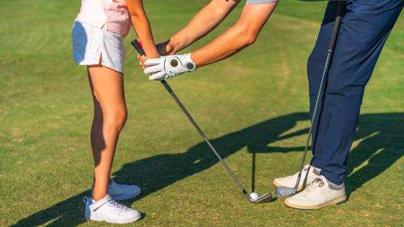 Closeup Instructor Teaching Golf Lessons Girl