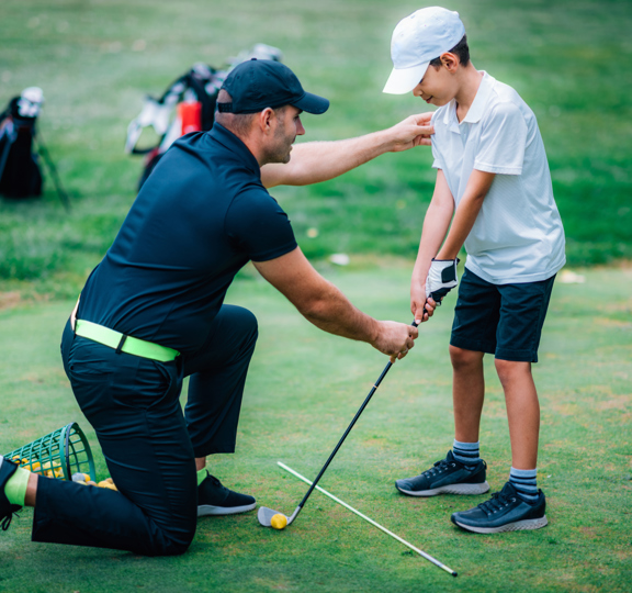 Golf Lessons Golf Instructor Giving Game Lesson Young Boy (2)